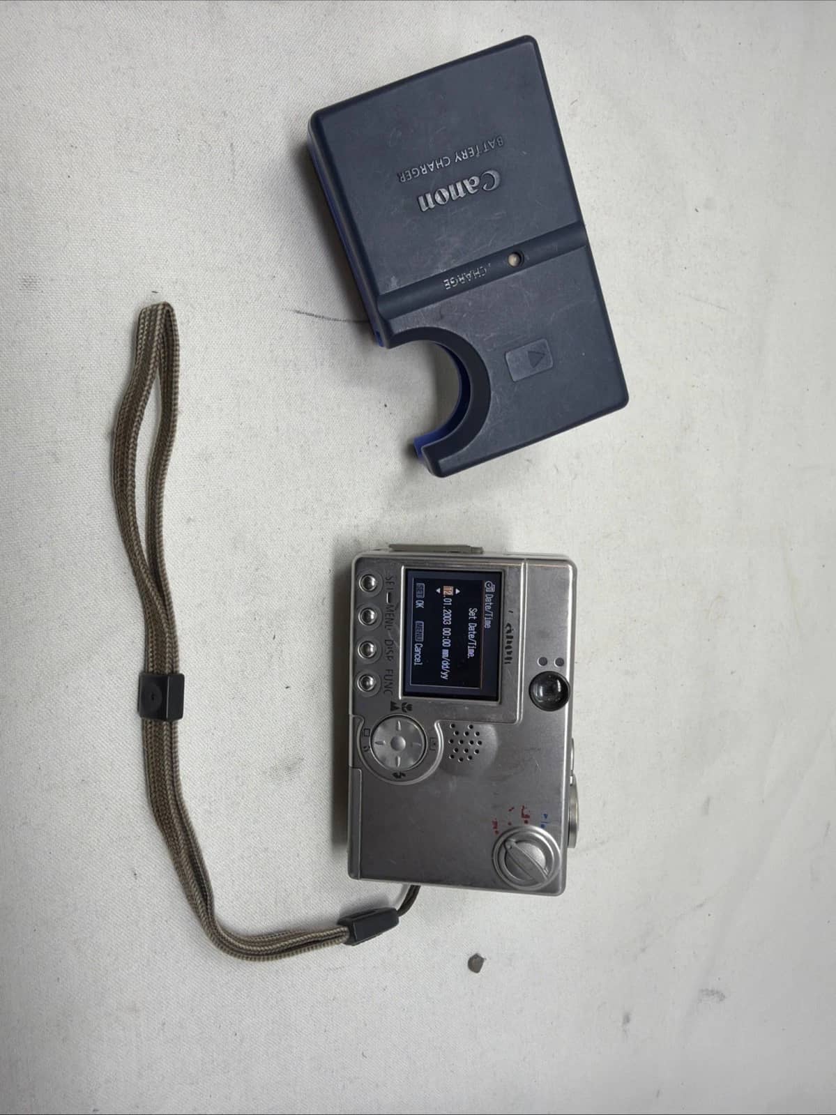 Canon PowerShot SD100 Digital Cameras Silver For parts or not working Body Only